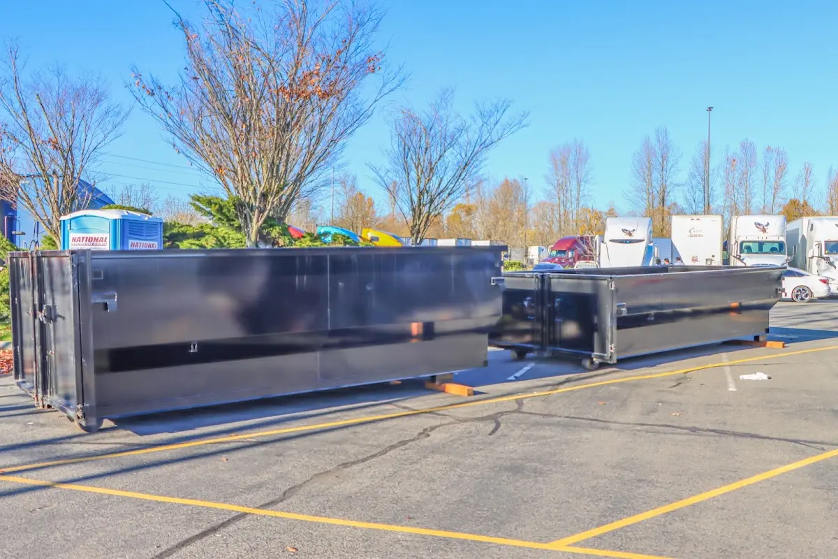 Professional dumpster rental service with roll-off container on residential driveway in Sharonville